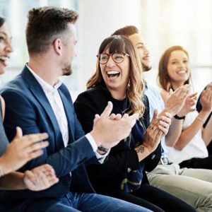 Shot of a group of businesspeople applauding during a seminar